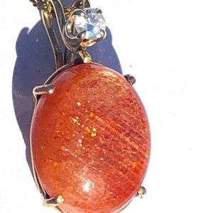 14 kt gold , diamond, & natural sun stone pendant